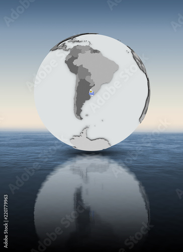 Uruguay on globe above water