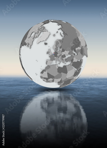 Netherlands on globe above water