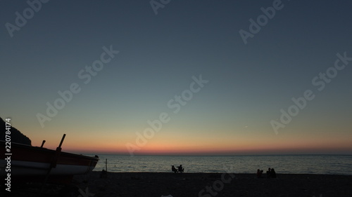 Sunset, boat and beach