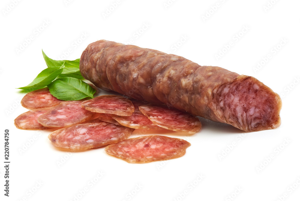 Smoked sausage with slices and green basil leaves, isolated on white background