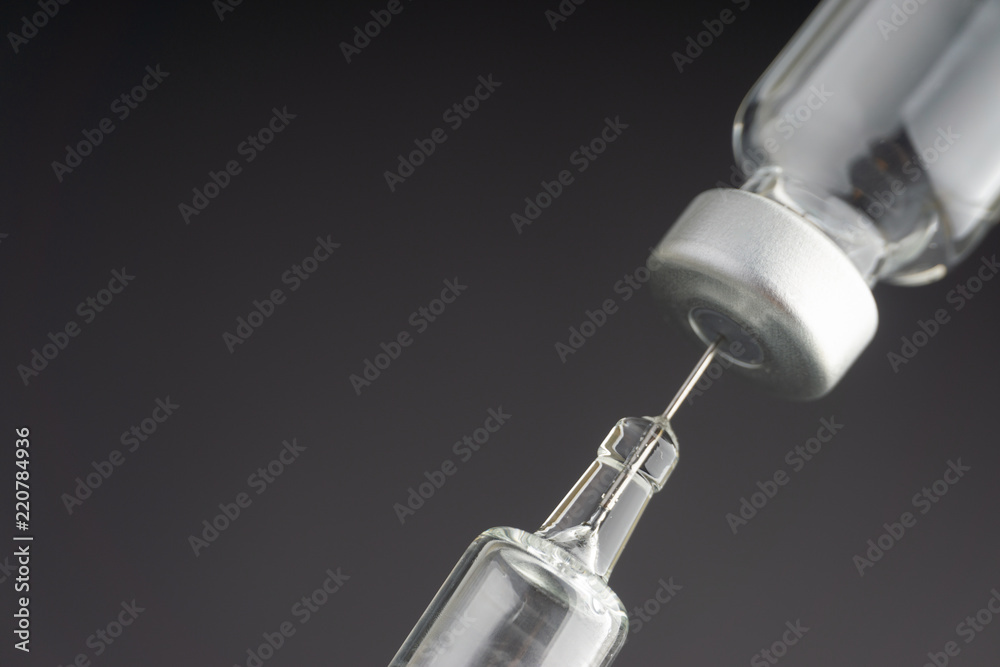 Syringe and vials closeup with selective focus and crop fragment. Medical and Healthcare Concept
