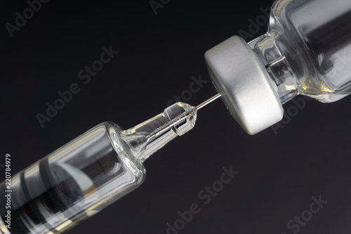 Syringe and vials closeup with selective focus and crop fragment. Medical and Healthcare Concept