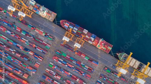 Aerial view container ship and warehouse from sea port for delivery containers shipment. Suitable use for transport or import export to global logistics concept.