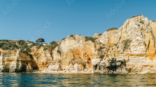 Rocks, Cliffs And Ocean Landscape At Lagos Bay Coast In Algarve, Portugal