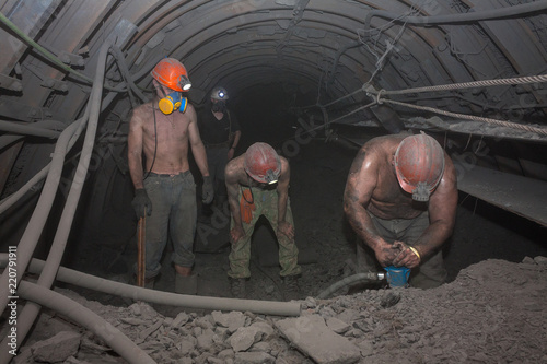 Fotografie, Obraz Miners work in underground mining. Donetsk, Ukraine