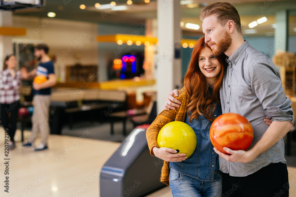 Fototapeta premium Beautiful couple dating and bowling