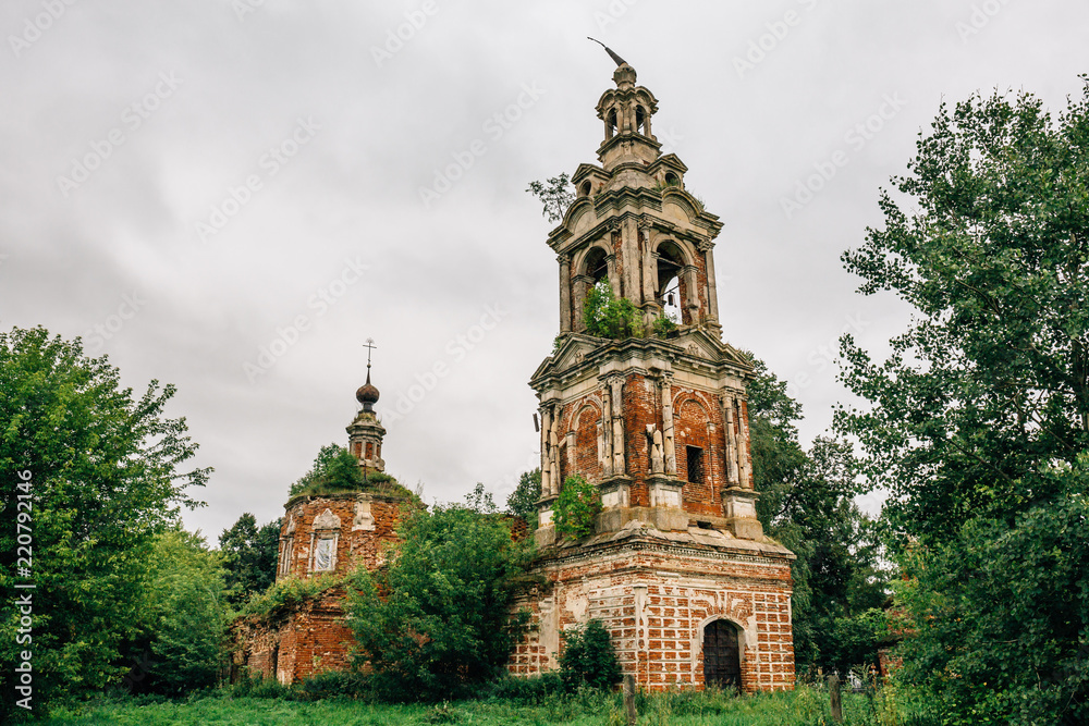 Abandoned and ruined ancient Orthodox Russian Church with tower