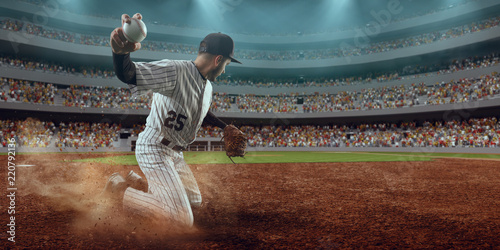 Obraz na płótnie Baseball player throws the ball on professional baseball stadium