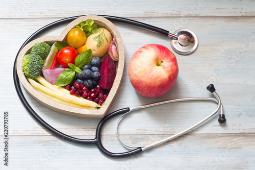 Fotografie Healthy food in heart diet concept with stethoscope