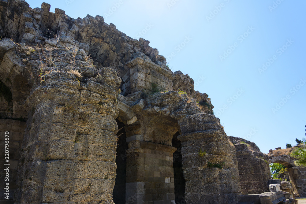 ruins of the ancient amphitheater with arched spans. Side, Turkey
