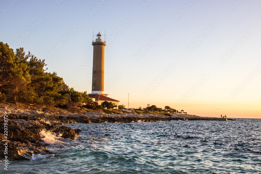 Fototapeta premium Leuchtturm im Sonnenuntergang