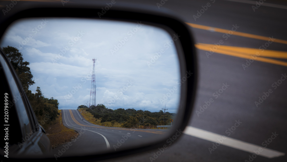 Rear car mirror. reflection of the sky, clouds Rear car mirror. reflection of the sky, clouds