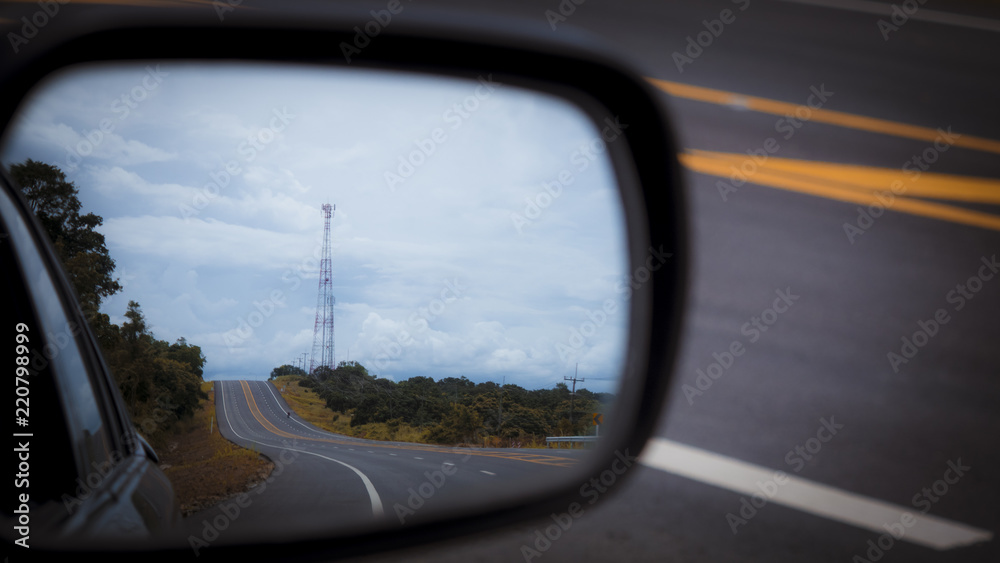 Rear car mirror. reflection of the sky, clouds