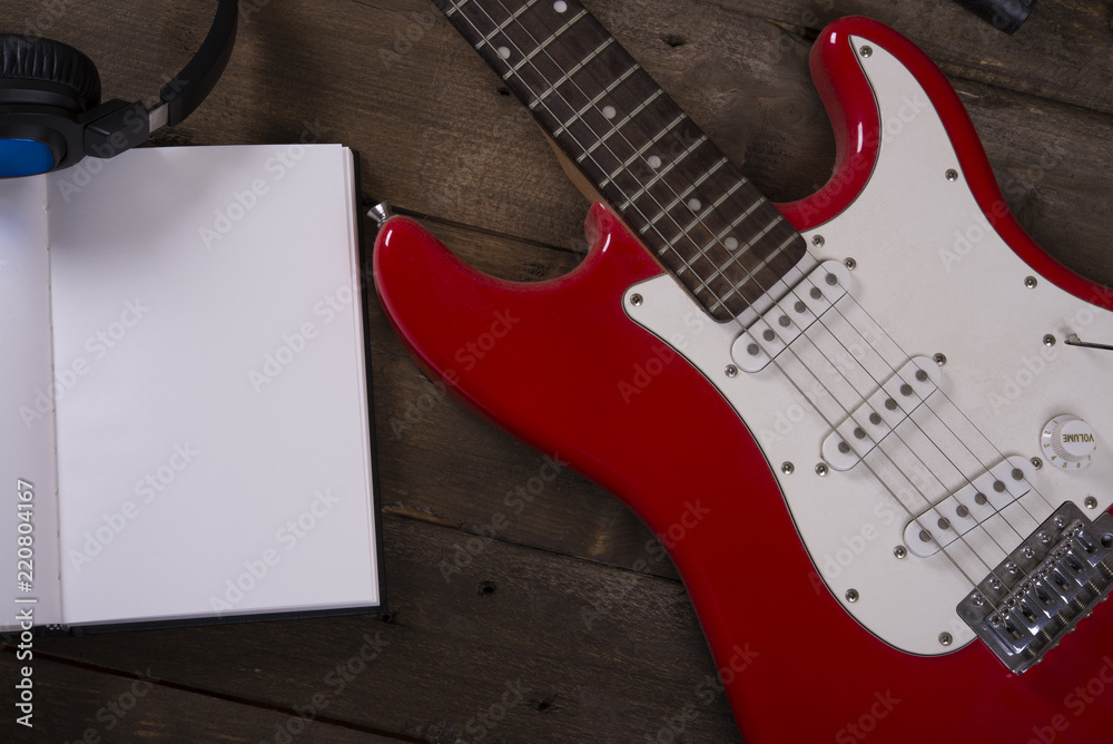 Fototapeta premium Electric guitar wallpaper with writing pad