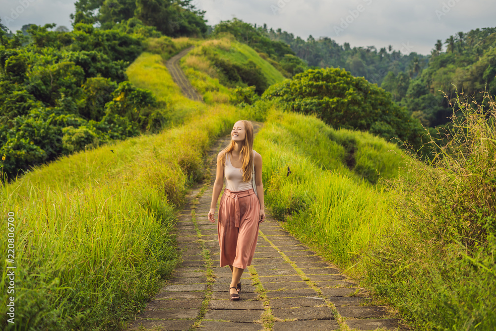 Young woman traveler in Campuhan Ridge Walk , Scenic Green Valley in Ubud  Bali Stock Photo | Adobe Stock