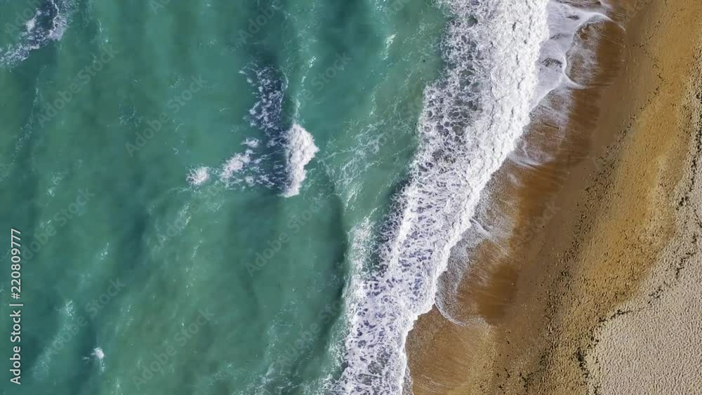 Aerial view of ocean shore with blue waves Aerial view of ocean shore with blue waves