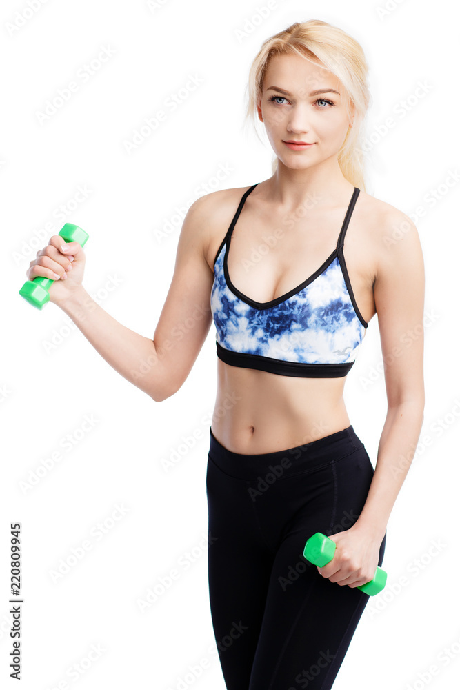 Fit young pretty woman exercises with dumbells. Biceps exercise. Health conception. Fit young pretty woman exercises with dumbells. Biceps exercise. Health conception.