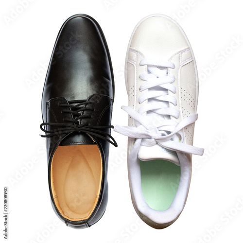 Male black leather shoes and White sneakers isolated on white background. Objects with clipping path. Top view