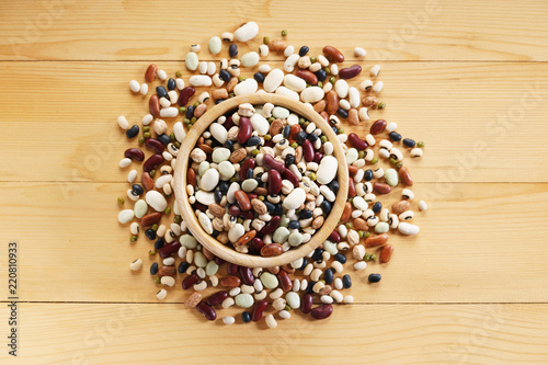 mixed beans on wooden background