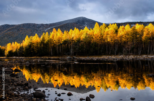 Mountain lake with yellow forest, Russia, Siberia, Froliha near lake Baikal