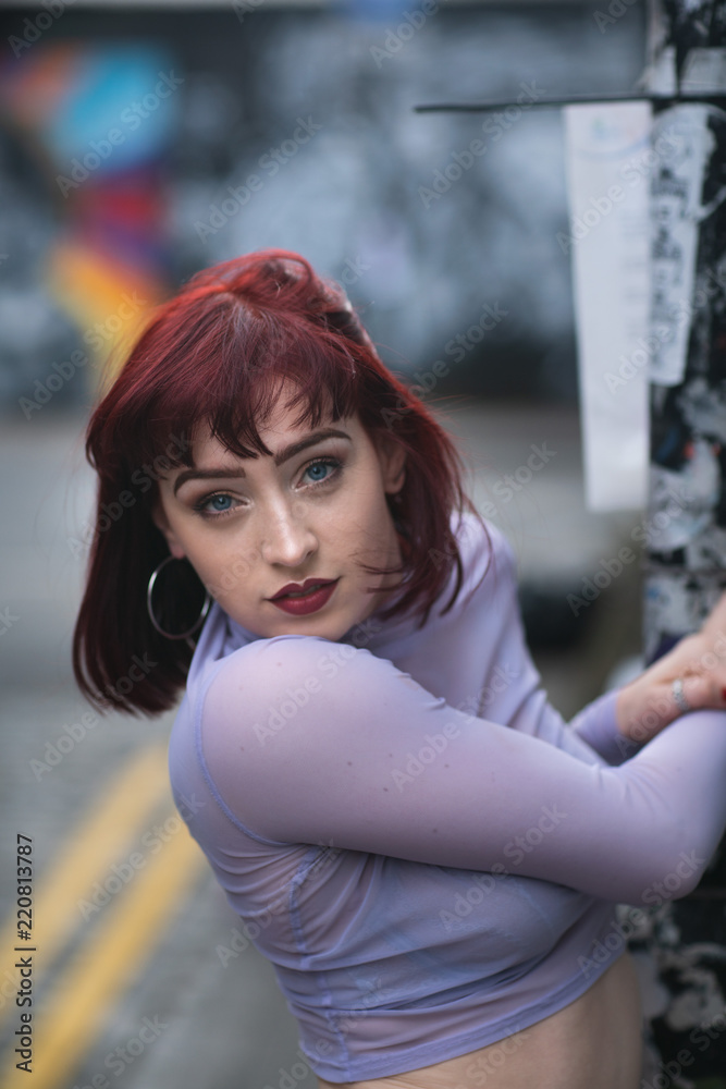 Fototapeta premium Portrait of young redhead with purple turtle neck