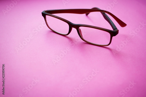 glasses on a pink background