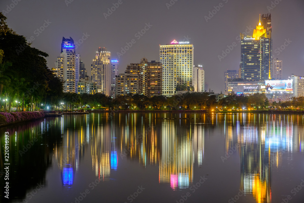 City downtown at night with reflection of skyline
