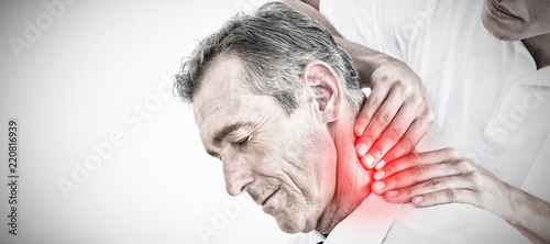 Composite image of male chiropractor massaging patients neck photo