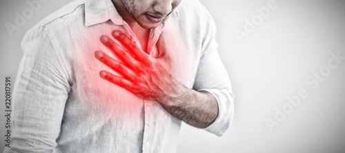 Obraz na płótnie Composite image of casual young man with chest pain