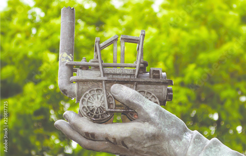 'Locomotive' - Detail of the statue of George Stephenson located outside the railway station at Chesterfield, UK. photo