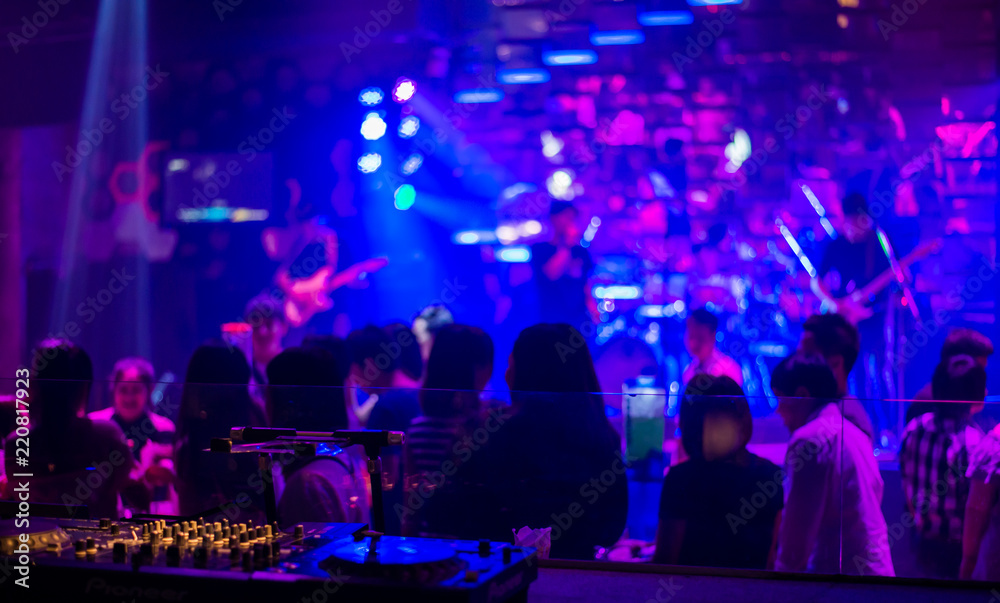 blurry image for background of Crowd in concert music show,Live show of musician for background, vintage tone