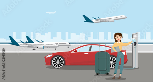 Woman is standing next the electric car and looks at the smart phone. The rental car is charging at the charging station for electric vehicles. Rent a car in the airport. 