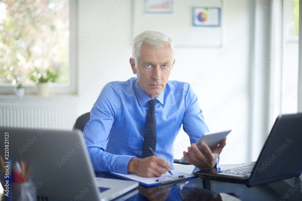 Executive businessman working in the office Executive businessman working in the office