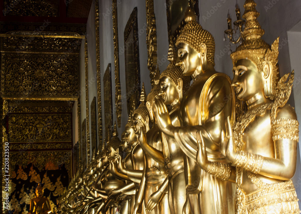 Row of golden buddhas statue at Wat Den Salee Sri Muang Gan (Wat Ban Den), Mae Taeng, Chiang Mai, Thailand, 11 - Aug - 2018