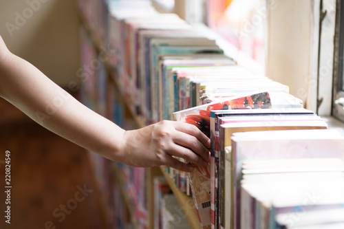 People selecting book in the libery as for education concept background.