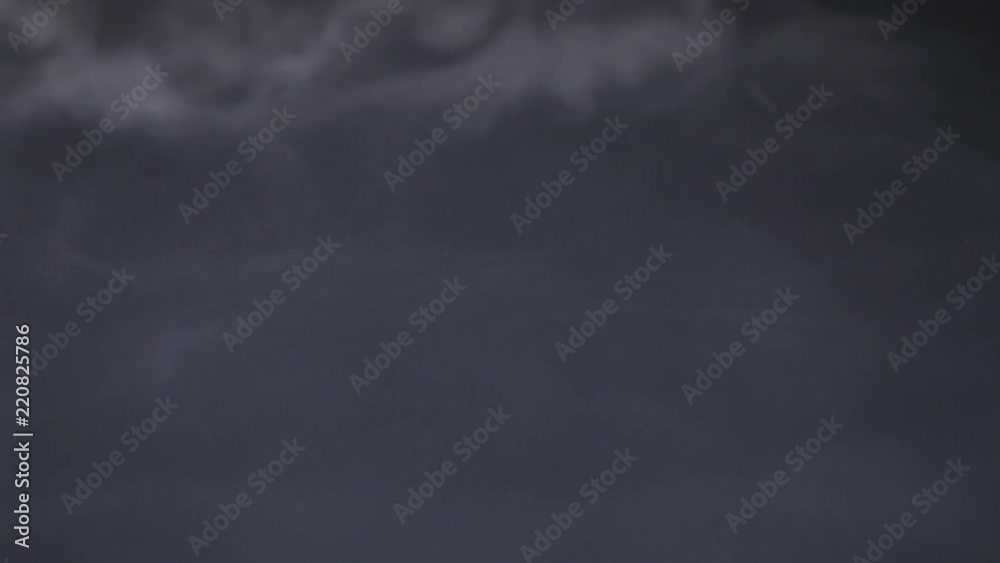 Cigarette smoke spreads on a black background Cigarette smoke spreads on a black background