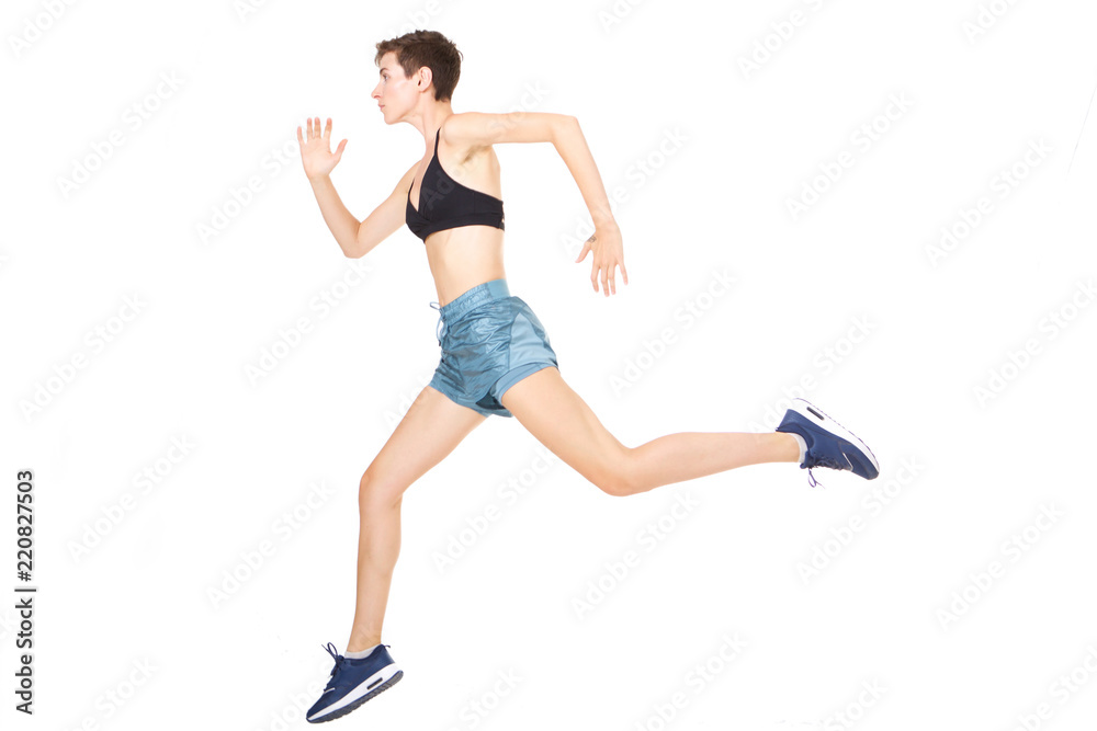 Full length active young woman jumping on isolated white background