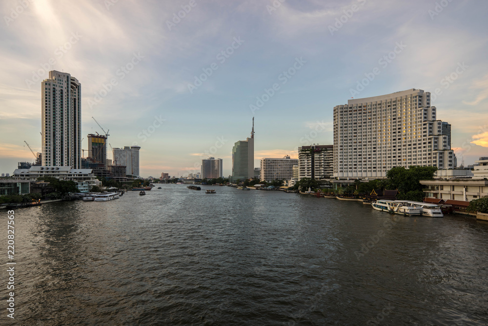 Beautiful sunset Chao Phraya River of the Metropolitan Bangkok City downtown cityscape urban , Cityscape Bangkok city Thailand