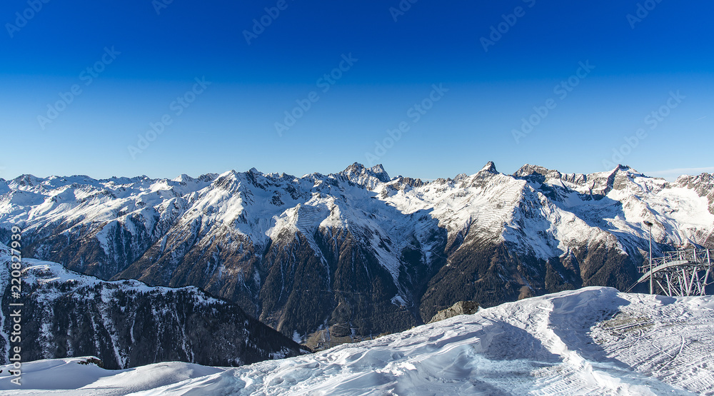 Naklejka premium Panorama of the Alpine mountains in the evening at the ski resort of Ischgl, Austria.
