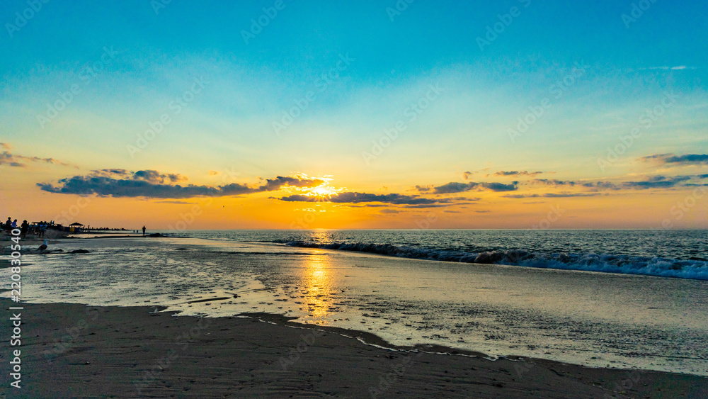 Sunset on the beach on north side of the Provincelands Cape Cod, Atlantic ocean view MA US.