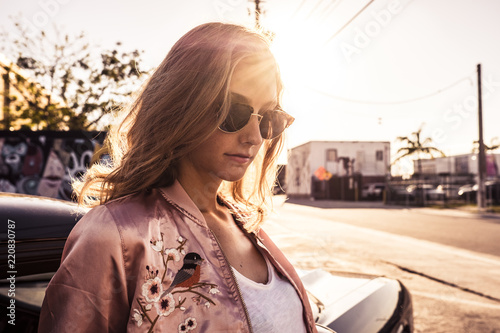 hipstar woman with sun glasses at sunset