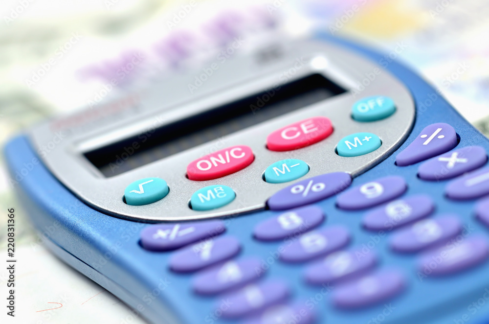 Close-up of calculator on money - concept of financial background Close-up of calculator on money - concept of financial background