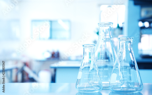 three glass flask in science technology education laboratory background