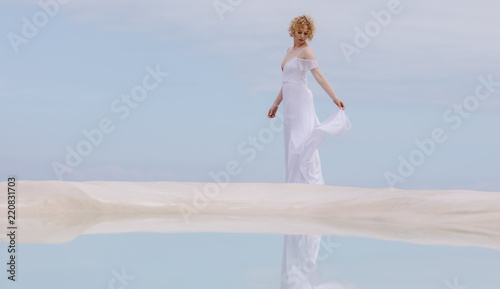 Woman standing at the beach