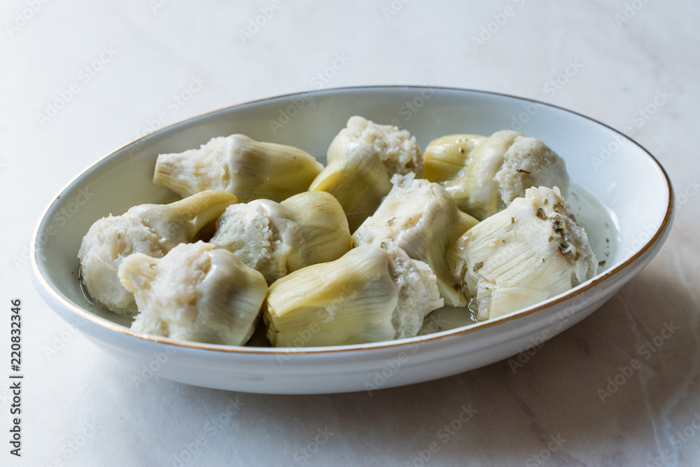 Pickled Artichoke Hearts Pickle Marinated in Plate. Pickled Artichoke Hearts Pickle Marinated in Plate.