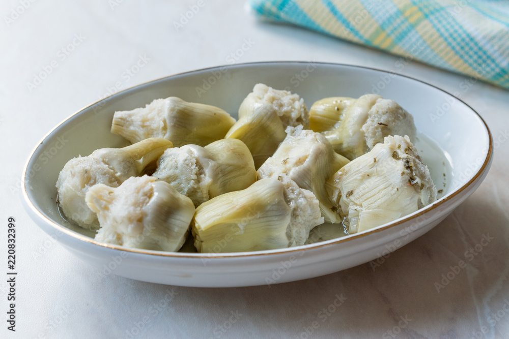 Pickled Artichoke Hearts Pickle Marinated in Plate. Pickled Artichoke Hearts Pickle Marinated in Plate.
