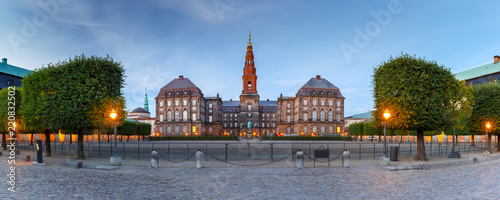 Panoramic view of Christiansborg, palace and government building, the seat of parliament, during morning blue hour, Copenhagen, capital of Denmark photo