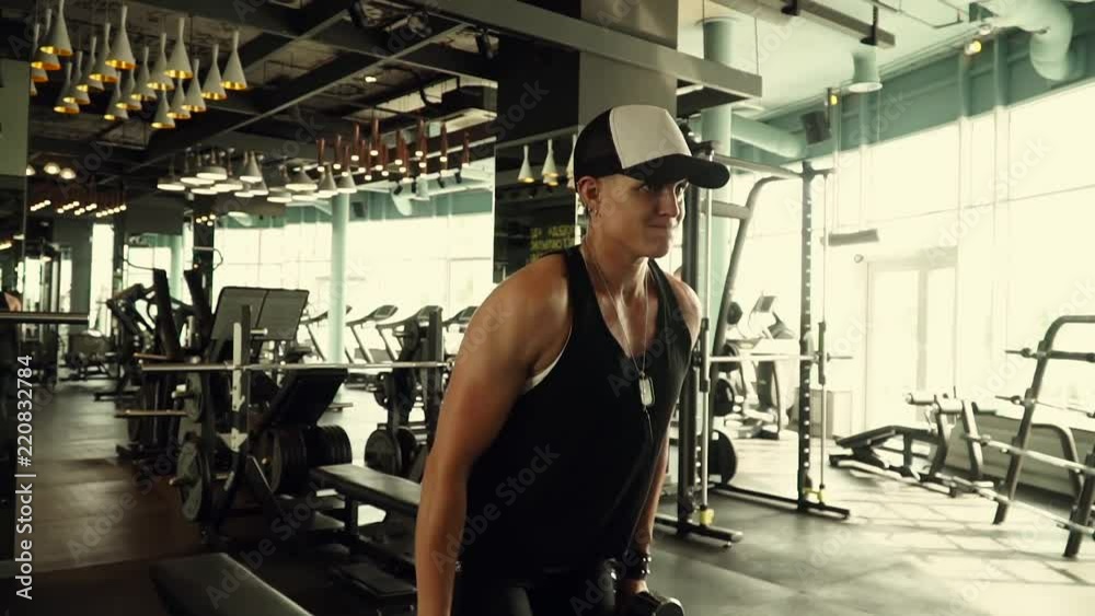 Strong girl working out with dumbbells Strong girl working out with dumbbells