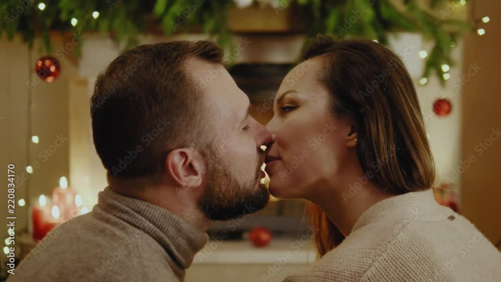 Happy beautiful couple celebrating Christmas