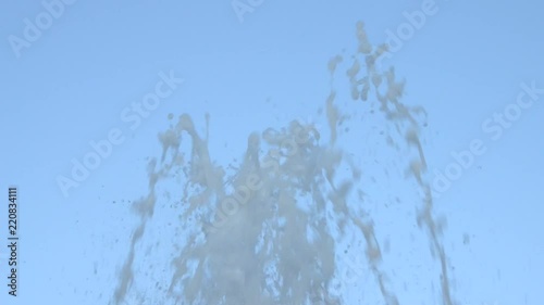 Water jets from a fountain changing shapes of spraying up in the air